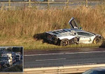 Lamborghini supercar worth £260,000 is left destroyed on the verge after M6 crash caused long tailbacks - Photo