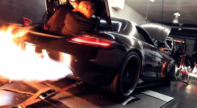 SLS AMG spewing flames and a guy is in the trunk. Nothing is faked. - Photo