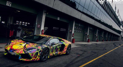 This Lamborghini Aventador looks like it was dropped in rainbow paint. - Photo