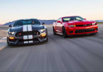 Two Muscle Cars In A Tight Battle! - Photo