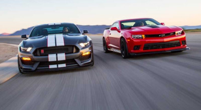 Two Muscle Cars In A Tight Battle! - Photo