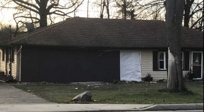 2011 Ford Mustang crashed into a house - Photo