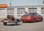Tesla Charging Issues Made A Russian Vlogger To Hit The Road With A Generator - Photo