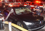 Firefighters Break The Windows Of A BMW Parked In Front Of A Hydrant - Photo