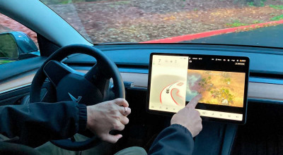 The <span style='background: #ff0000'>NHTSA</span> Is Looking Into Tesla As Drivers Can Play Video Games While Driving - Photo