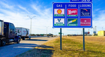 Highway Sign Secrets: How Businesses Get on Those Blue Roadside Signs - Photo