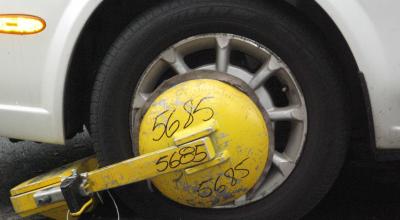Car Booted? What to Do & How to Get It Off Your Wheel - Photo