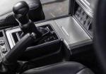 That Tiny Slot Beside Your Shifter Has a Job Most Drivers Never Discover - Photo