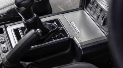 That Tiny Slot Beside Your Shifter Has a Job Most Drivers Never Discover - Photo