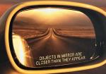 Why Is “Objects in Mirror Are Closer Than They Appear” Printed on Only One Mirror? - Photo