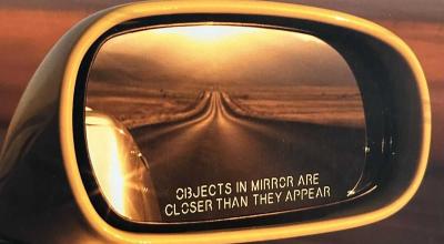 Why Is “Objects in Mirror Are Closer Than They Appear” Printed on Only One Mirror? - Photo