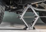 Move the Jack a Few Inches Too Far and a Flat Tire Can Become Body Damage - Photo