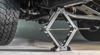 Move the Jack a Few Inches Too Far and a Flat Tire Can Become Body Damage - Photo