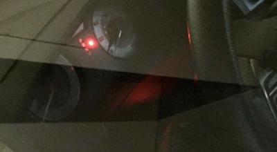 That Tiny Red Light Blinking in Your Parked Car May Be Good News - Photo