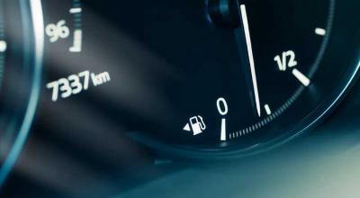 A Ford Engineer Got Soaked and Invented the Tiny Arrow Beside Your Fuel Gauge - Photo